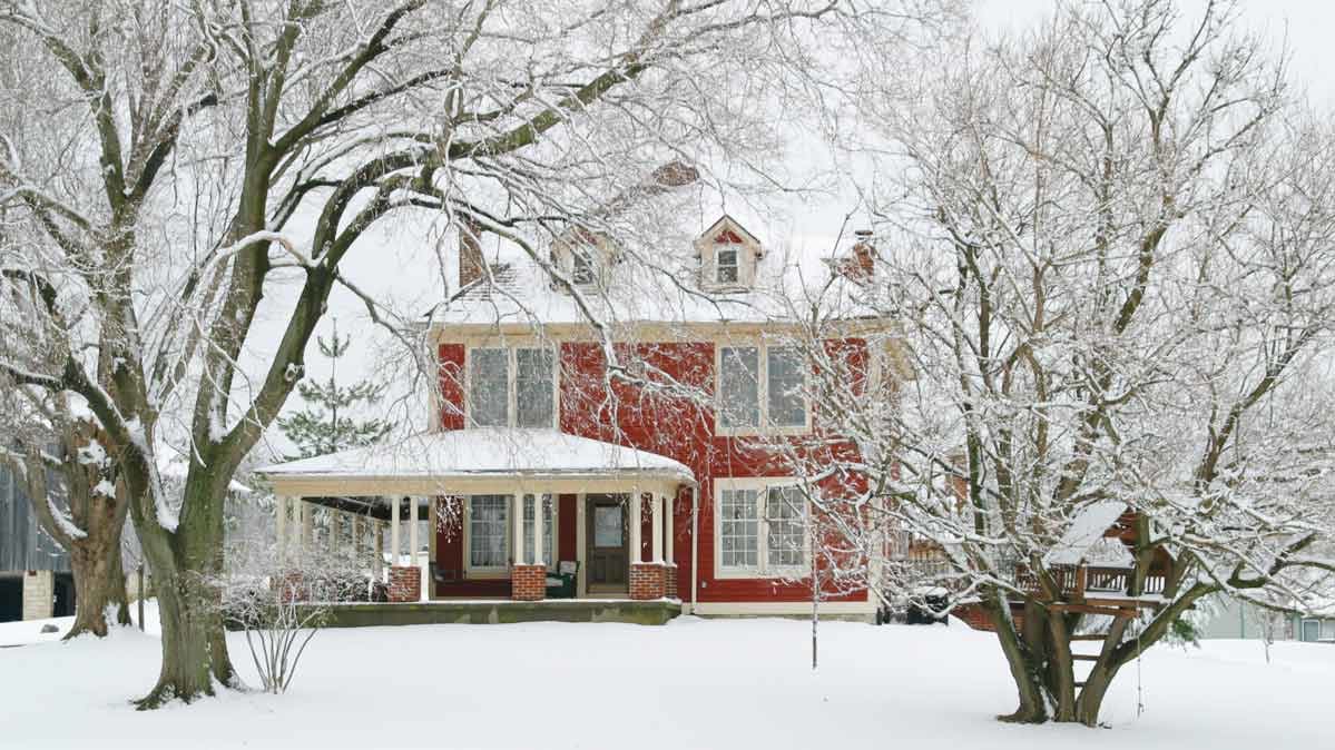 A red house in the snow.